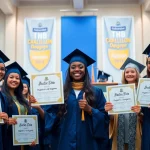 Proud graduates displaying their bachelor urkunde certificates at a university graduation ceremony.